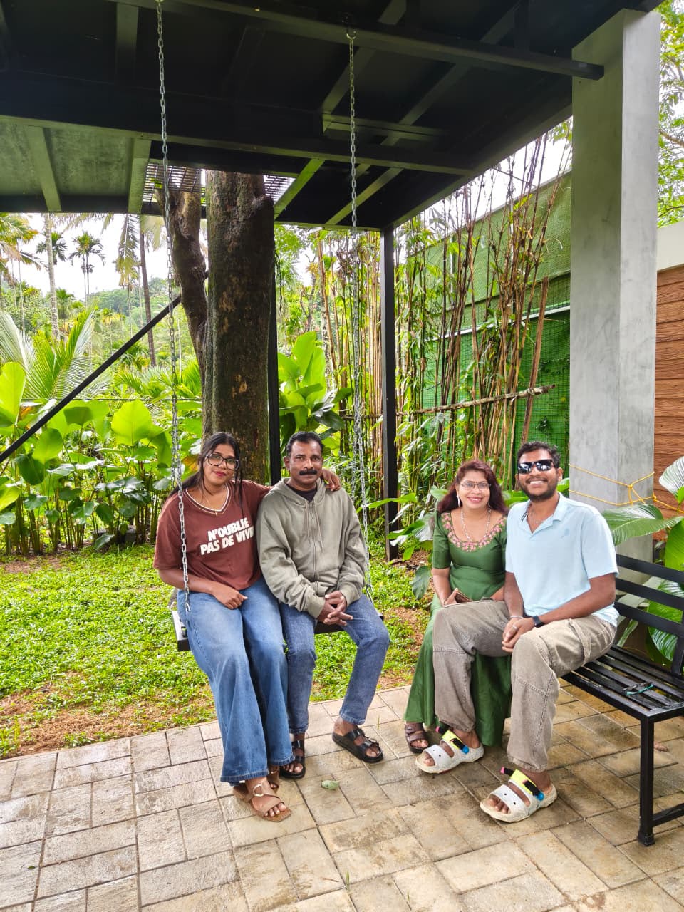 Family relaxing on the garden swing