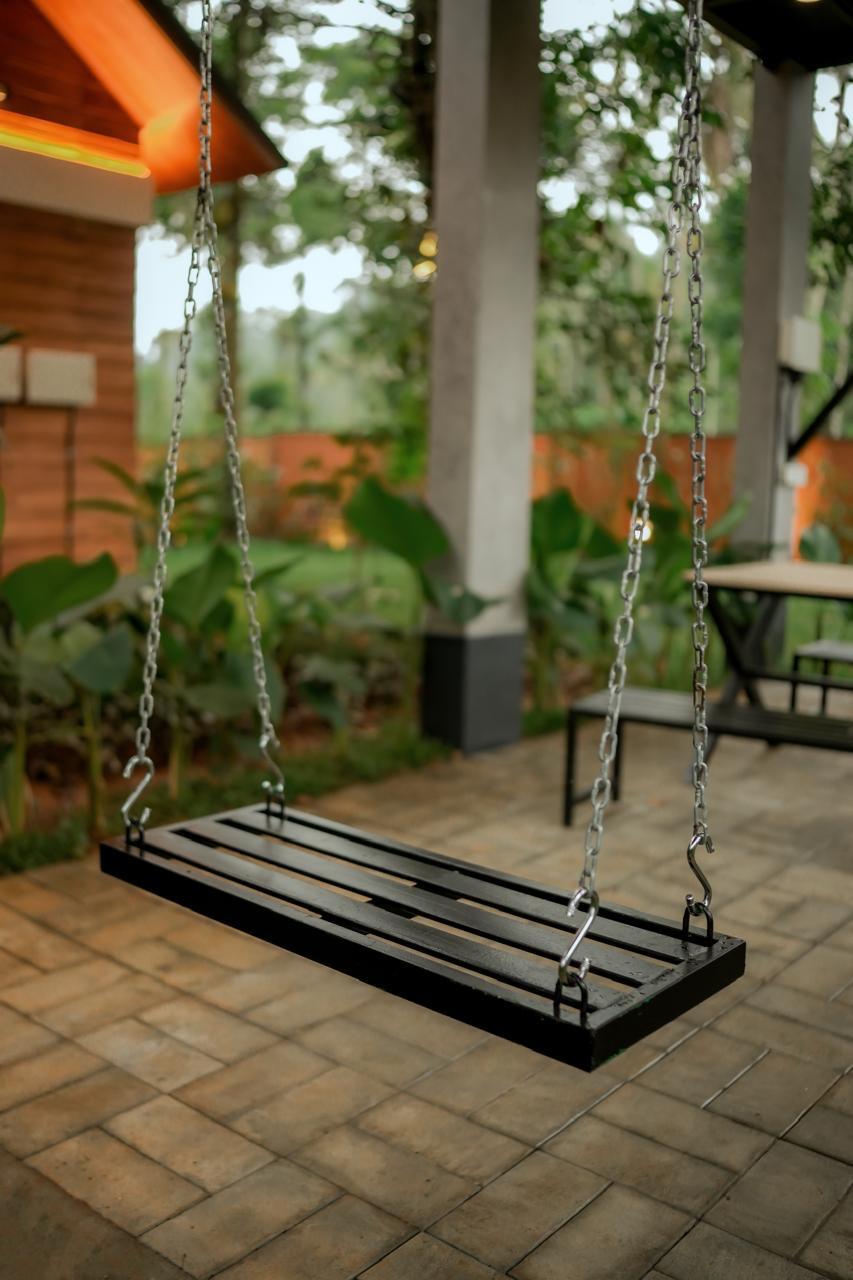 Outdoor swing in garden courtyard